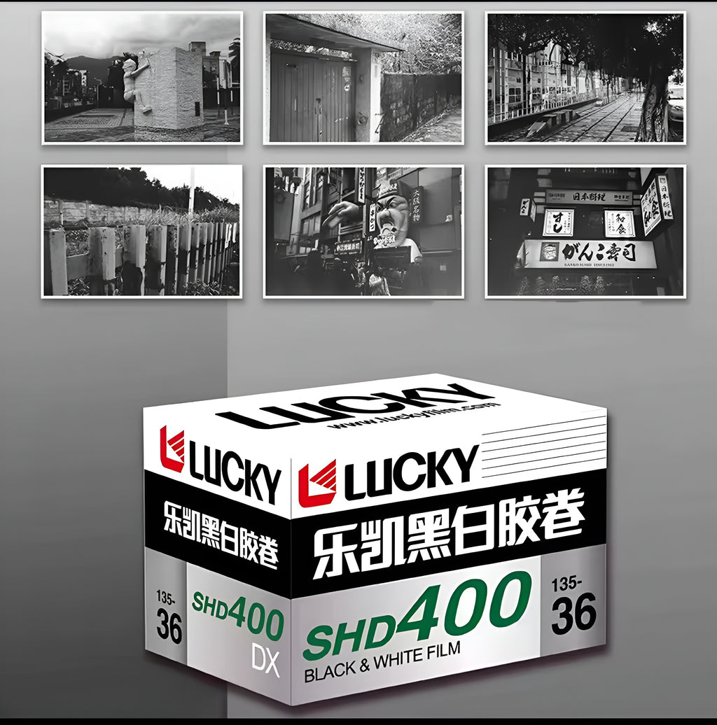 Box of Lucky black and white film with black and white photos in the background